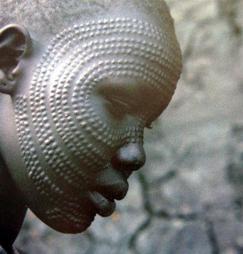 African tribal scarification The skin is cut etched burned or branded  into a design Ouch  roddlyterrifying